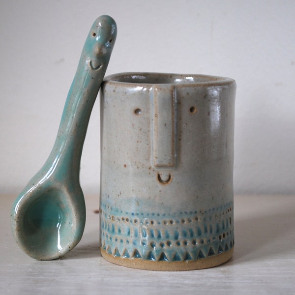 Little pot in turquoise glaze with white spoon