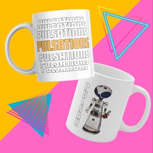 May include: Two white ceramic mugs. One mug features the word "PULSATIONS" repeated in a stacked pattern. The other mug features a cartoon robot with the word "PULSAR" written vertically on the side.
