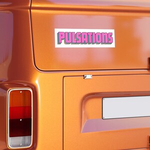 May include: A white sticker with a pink outline and the word "PULSATIONS" in pink letters with a yellow outline on a brown van.