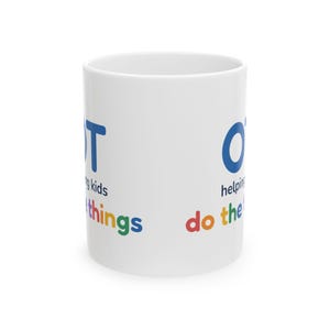 May include: A white ceramic mug featuring the blue text OT, followed by the black text helping kids, and the multicolored text do the things. The design is printed on the side of the mug with a smooth, cylindrical surface and a handle.