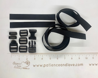 May include: Black webbing straps and plastic buckles for crafting projects. The straps are approximately 1 inch wide and the buckles are various sizes.