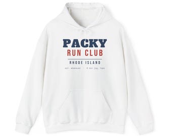 May include: A white hooded sweatshirt featuring the text PACKY RUN CLUB in dark blue and red lettering, with RHODE ISLAND and the text est. whenever - 5 min jog, tops printed below. The garment includes a front kangaroo pocket and drawstrings.