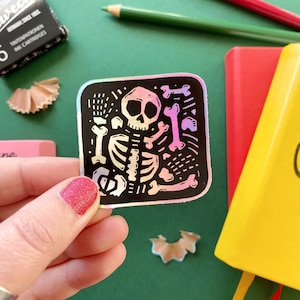 Skeleton Holographic Vinyl Sticker. Archeology Sticker. Bones and Skull Sticker. Holo Sticker. Autumn Sticker. Fall Sticker. Gothic Sticker.