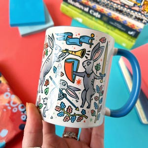 Duelling Bunnies Mug: Medieval Art Ceramic Mug