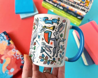 Duelling Bunnies Mug: Medieval Art Ceramic Mug