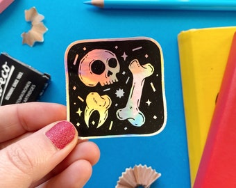 Skull and Bones Holographic Vinyl Sticker. Halloween Stationery and Stickers.