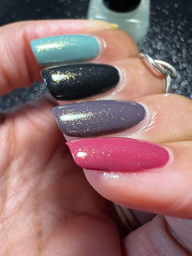 Starlight Polish Topaz over light green, black, purple, and pink - @crazy4polish0319