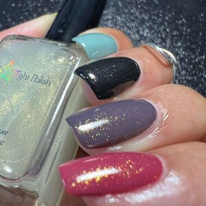 Starlight Polish Topaz over light green, black, purple, and pink - @crazy4polish0319