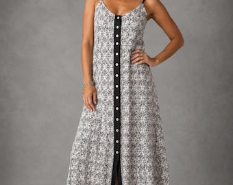 May include: A floor-length sleeveless dress featuring a black and white geometric pattern. The garment has thin spaghetti straps, a V-neckline, and a central vertical black placket running down the front, accented with a row of small white buttons.