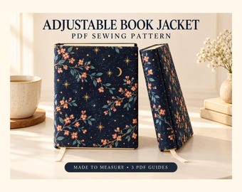 Può includere: Un cartamodello PDF per copertina di libro regolabile in tessuto blu scuro con stampa di fiori rosa, foglie verdi, stelle dorate e una luna crescente. Il testo recita ADJUSTABLE BOOK JACKET PDF SEWING PATTERN e MADE TO MEASURE 3 PDF GUIDES.