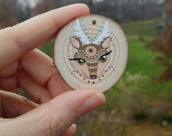 Hand painted animal ornaments on rustic wood slices