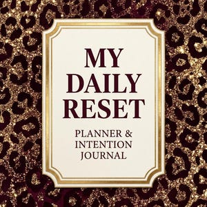 May include: A rectangular planner and intention journal with a dark burgundy and gold glitter leopard print background. The center features a cream-colored label with a gold border and the text MY DAILY RESET PLANNER & INTENTION JOURNAL.