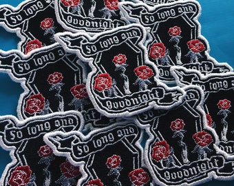 May include: A stack of black and white embroidered patches with red roses and the text "So long and goodnight".