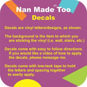 May include: A purple square sign with rounded corners featuring the text Nan Made Too Decals in white and yellow. The sign includes instructions about vinyl letters, application directions, and low-tack tape, accented by orange, blue, yellow, and green shapes.