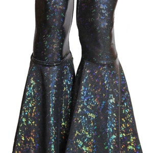 May include: Black flared pants with a iridescent, glittery finish. The pants have a wide leg opening and a fitted waist.