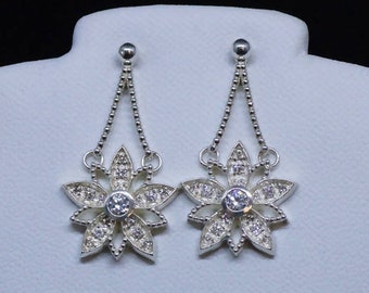 Cast White CZ Sterling Silver Flower Earrings with White CZ Accents