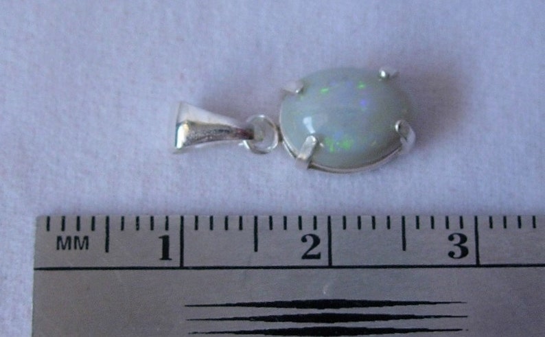 Sparkling Green Purple and Red Lightning Ridge Opal in Silver Pendant