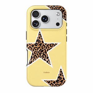 May include: A pale yellow smartphone case featuring two large stars with a brown and black leopard print pattern. The case has a white outline around the stars and the word Gioletta printed in small black letters between the two star shapes.