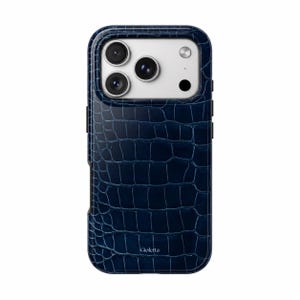 May include: A dark blue phone case with a textured crocodile skin pattern. The case features a rectangular cutout for the camera array and the word Gioletta printed in white near the bottom edge of the back panel.