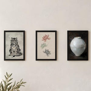 Three of the designs, tiger, peony and moon jar, shown printed and framed in a row on a light wall (digital room mockup); frames and prints are not included.