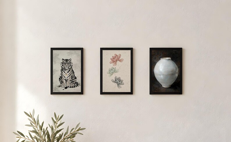 Three of the designs, tiger, peony and moon jar, shown printed and framed in a row on a light wall (digital room mockup); frames and prints are not included.