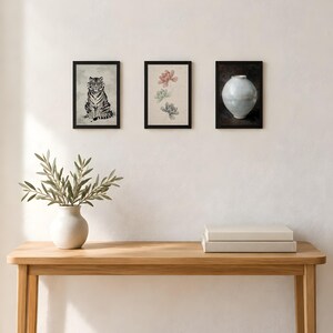 Three 4x6 inch prints (tiger, peony and moon jar) hung in a row above a wooden console table; the frames shown are not included.