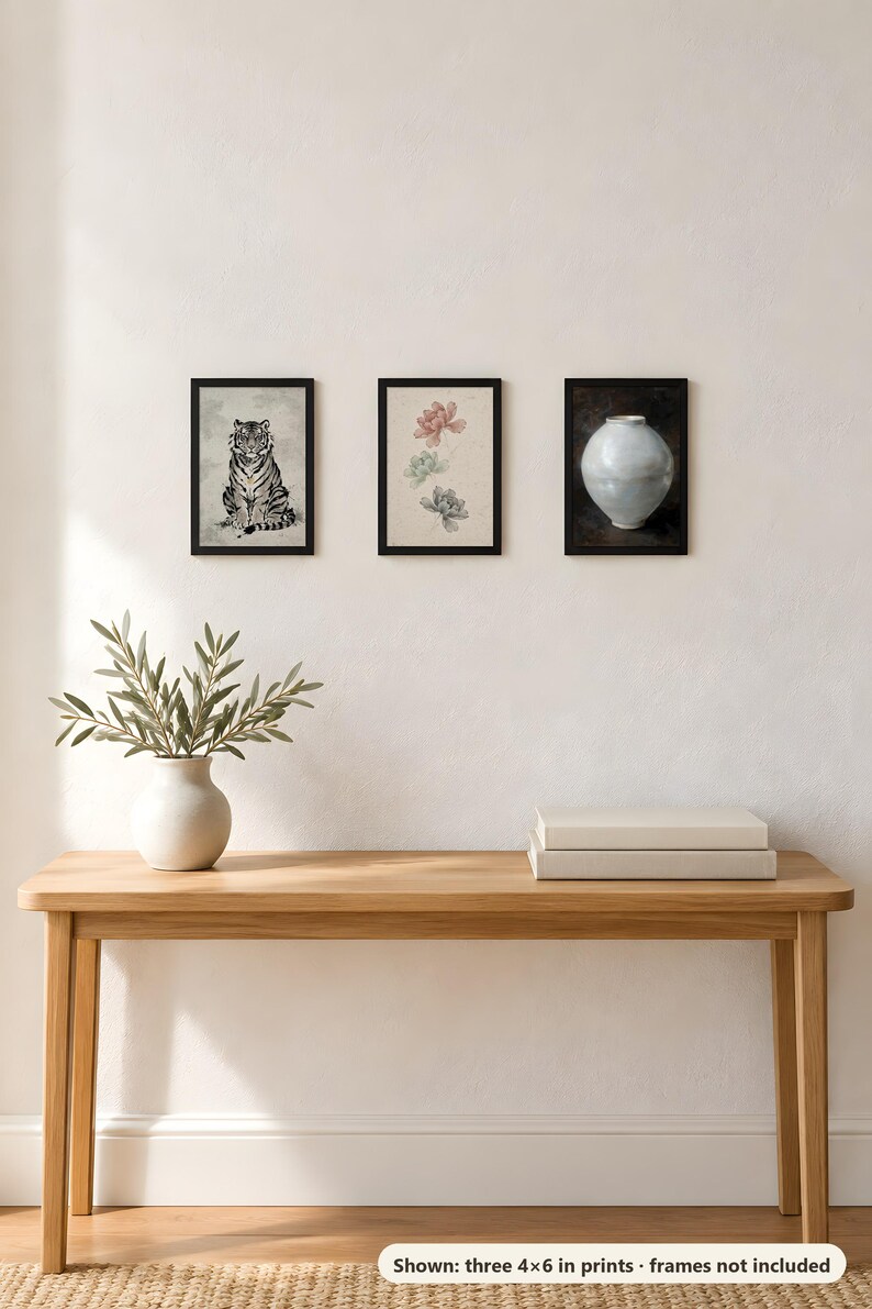 Three 4x6 inch prints (tiger, peony and moon jar) hung in a row above a wooden console table; the frames shown are not included.