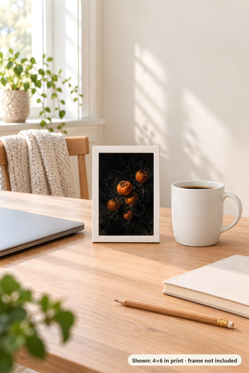Persimmon print in the 4x6 inch size standing on a wooden desk next to a coffee mug; the frame shown is not included.