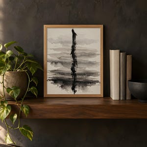 Abstract ink wash design printed in the 8x10 inch size on a dark wooden shelf with books and a plant; the frame shown is not included.