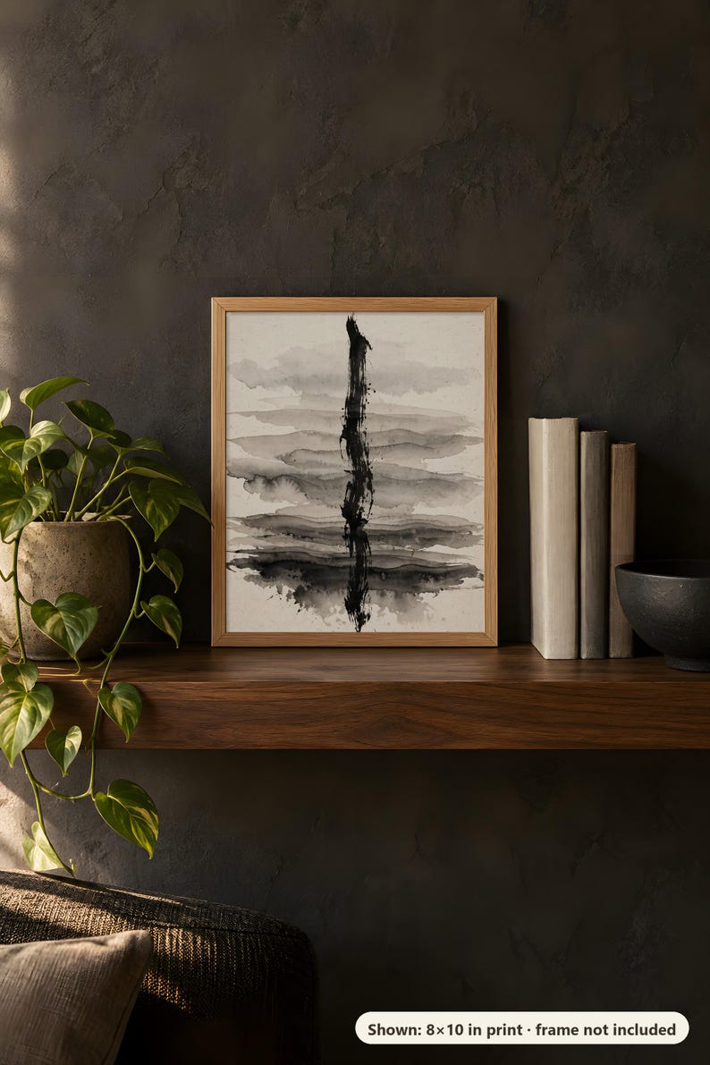 Abstract ink wash design printed in the 8x10 inch size on a dark wooden shelf with books and a plant; the frame shown is not included.