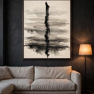Abstract ink wash print, one of the six set designs, shown framed above a gray sofa (digital room mockup).