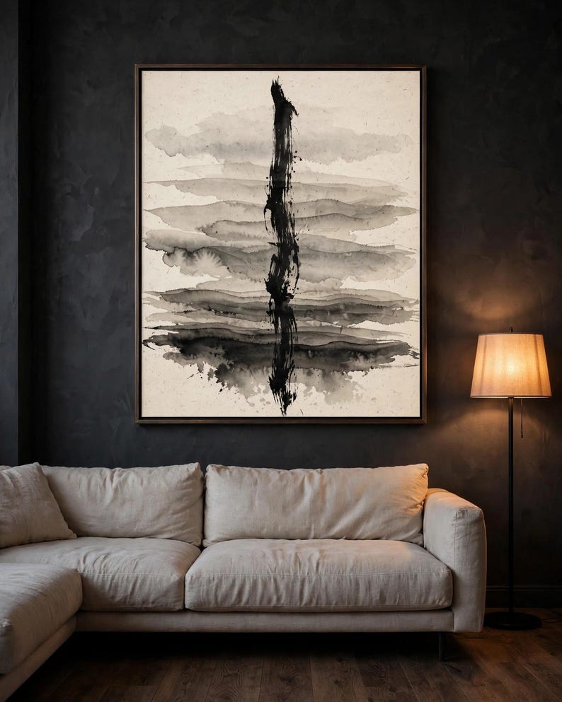 Abstract ink wash print, one of the six set designs, shown framed above a gray sofa (digital room mockup).