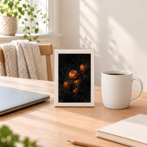 Persimmon design printed in the 4x6 inch size standing on a wooden desk next to a coffee mug; the frame shown is not included.