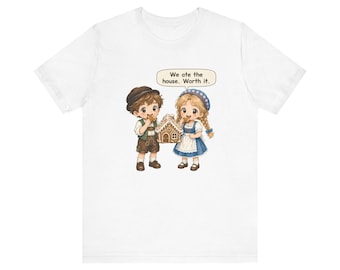 May include: A white t-shirt featuring a graphic of two children in traditional clothing eating a gingerbread house. A speech bubble above them contains the text: We ate the house. Worth it. The illustration shows a boy in a brown hat and vest and a girl in a blue dress with a white apron.