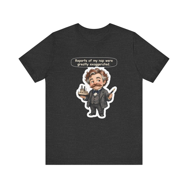 Watercolor chibi Mississippi riverboat author with a bushy moustache, navy bow tie and charcoal suit, holding a model riverboat and a fountain pen, with the speech bubble "Reports of my nap were greatly exaggerated." printed on a tee