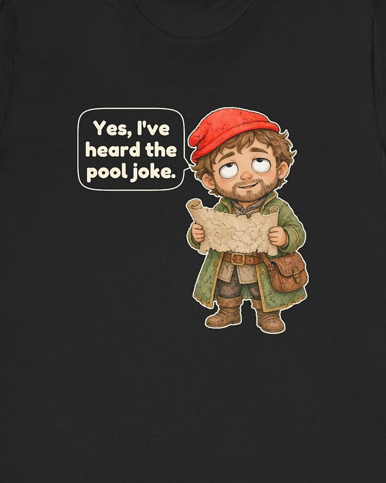 May include: A black t-shirt featuring a cartoon illustration of a bearded character wearing a red cap and green coat, holding a map. A speech bubble above the character contains the text: Yes, I've heard the pool joke.