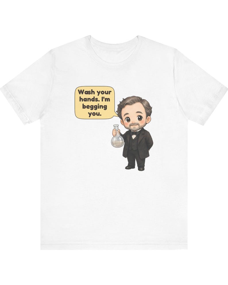May include: A white short-sleeved t-shirt featuring a cartoon illustration of a person in a black suit and bowtie holding a glass flask. A speech bubble next to the character contains the text: Wash your hands. I'm begging you.