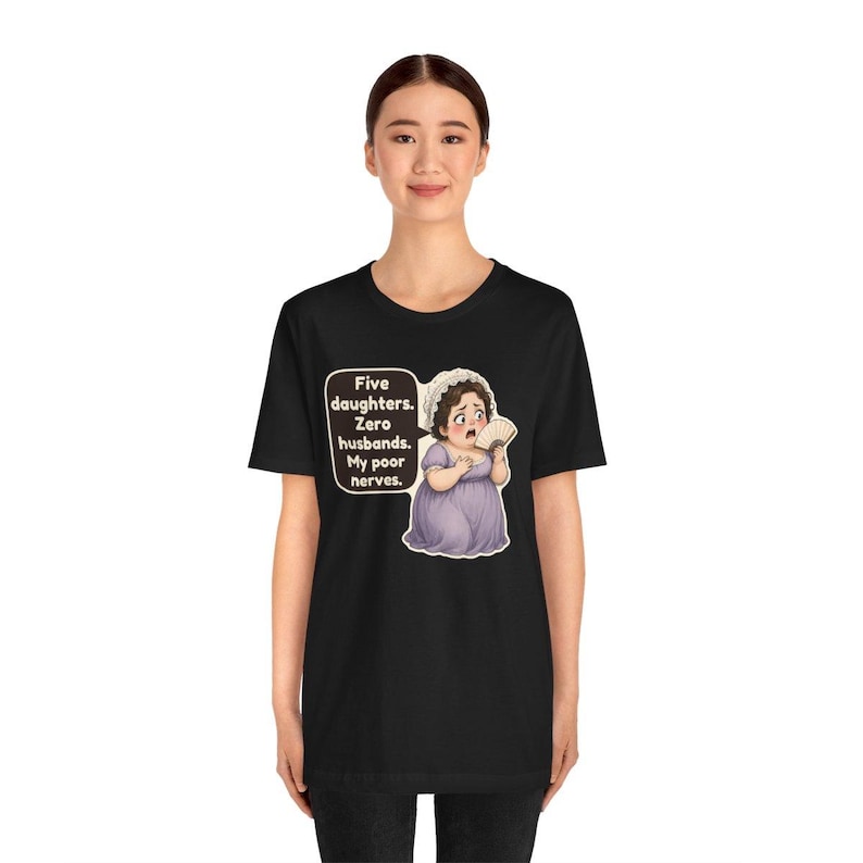 May include: A black t-shirt featuring a graphic of a woman in a light purple dress and white bonnet holding a fan. A speech bubble next to her contains the text: Five daughters. Zero husbands. My poor nerves.