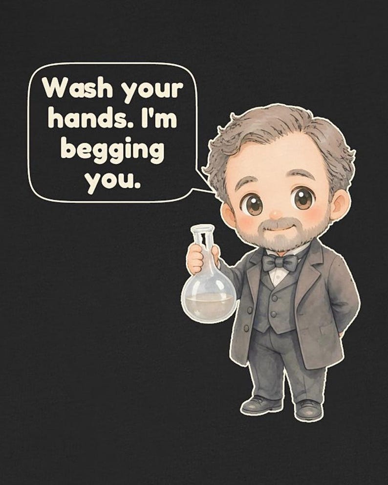 May include: A black t-shirt featuring a cartoon illustration of a man with a beard in a gray suit and bow tie, holding a glass flask. A speech bubble above him contains the text: Wash your hands. I'm begging you.