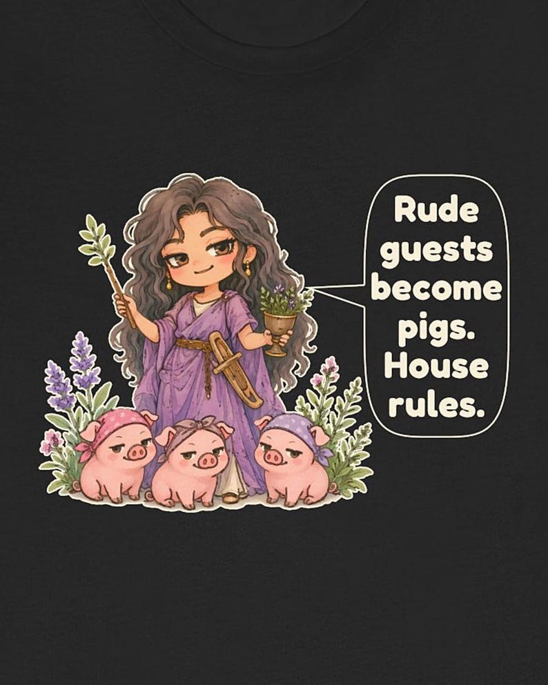 May include: A black t-shirt featuring a cartoon illustration of a person with long dark hair wearing a purple robe, holding a wand and a goblet. Three small pink pigs wearing bandanas sit at their feet. Text reads: Rude guests become pigs. House rules.