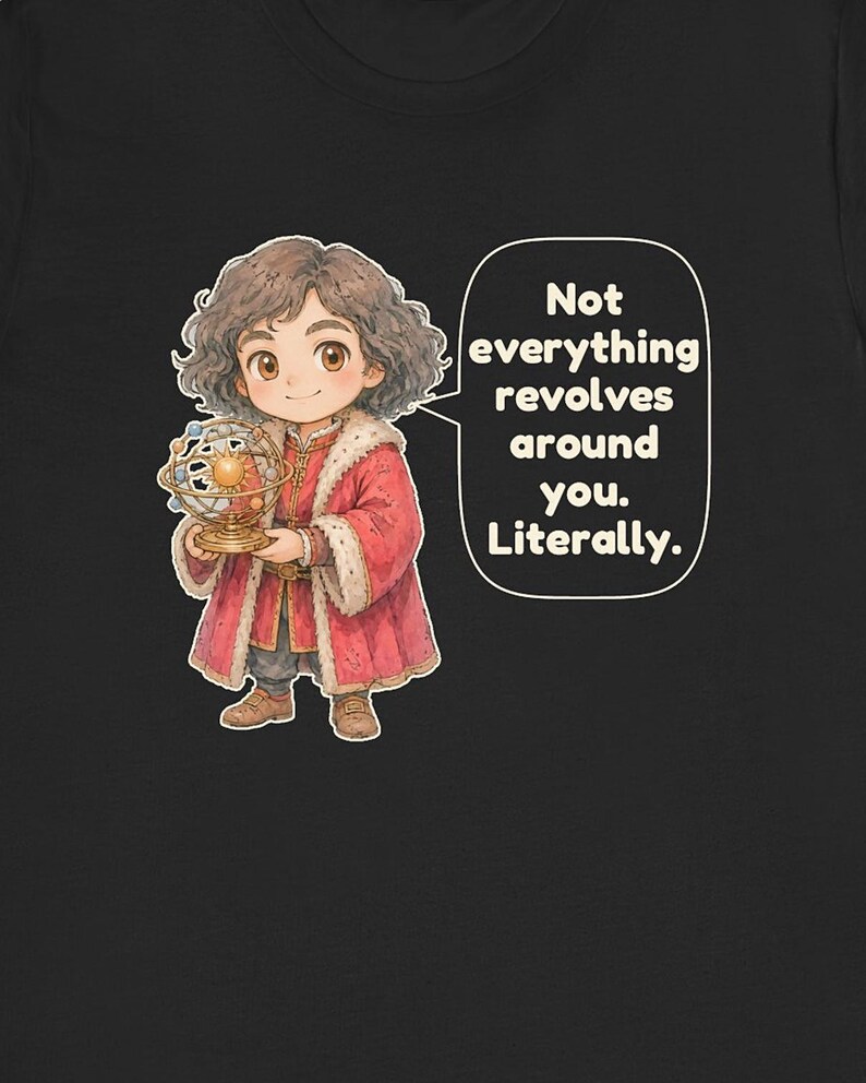 May include: A black t-shirt featuring a cartoon character with curly brown hair wearing a red coat with white fur trim. The character holds a gold orrery model of the solar system. A speech bubble contains the text: Not everything revolves around you. Literally.