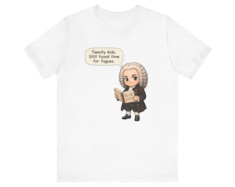 May include: A white short-sleeve t-shirt featuring a cartoon illustration of a historical figure with a powdered wig holding a music book. A speech bubble above the character contains the text: Twenty kids. Still found time for fugues.