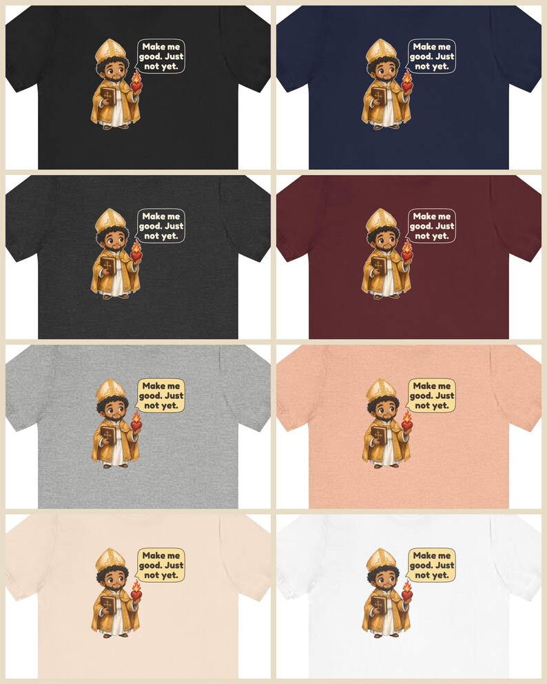 May include: A collection of eight t-shirts in various colors including black, navy, dark gray, maroon, light gray, peach, beige, and white. Each shirt features a cartoon illustration of a saint holding a book and a flaming heart with the text "Make me good. Just not yet."