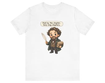 May include: A white t-shirt featuring a cartoon illustration of a bearded person in a dark green coat holding a white quill and a stack of books. A speech bubble above the figure contains the text: Paid by the chapter. Very long chapters.