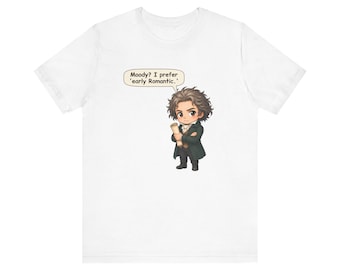 May include: A white short-sleeved t-shirt featuring a chibi-style illustration of a man with messy dark hair wearing a dark coat and holding a scroll. A speech bubble above the character contains the text: Moody? I prefer 'early Romantic.'