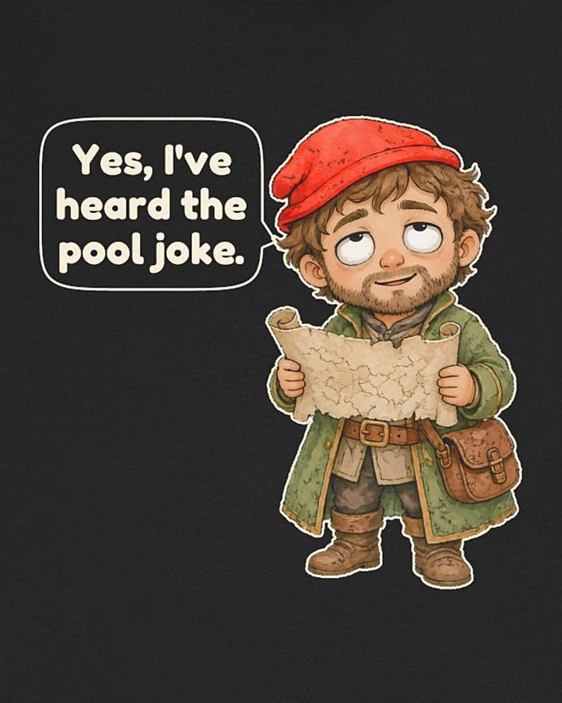 May include: A black t-shirt featuring a cartoon character wearing a red cap and green coat, holding a map. A speech bubble contains the text: Yes, I've heard the pool joke. The character has brown hair, a beard, and a brown satchel.