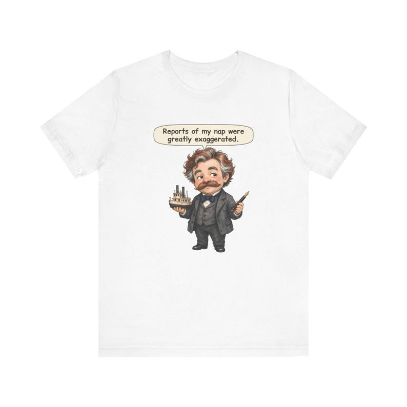 Watercolor chibi Mississippi riverboat author with a bushy moustache, navy bow tie and charcoal suit, holding a model riverboat and a fountain pen, with the speech bubble "Reports of my nap were greatly exaggerated." printed on a tee
