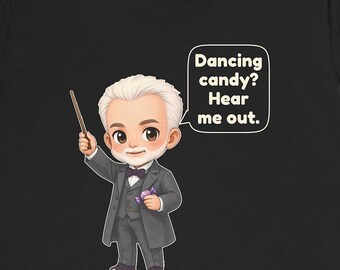 May include: A black t-shirt featuring a cartoon illustration of an older person with white hair wearing a gray suit, bow tie, and vest. The character holds a thin wand and a purple candy. A speech bubble contains the text: Dancing candy? Hear me out.