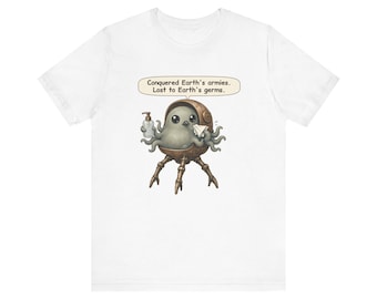 May include: A white t-shirt featuring a graphic of a small, grey, multi-tentacled creature in a bronze mechanical pod. The creature holds a hand sanitizer bottle and a tissue. A speech bubble above reads: Conquered Earth's armies. Lost to Earth's germs.
