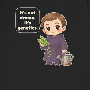 May include: A black t-shirt featuring a cartoon illustration of a monk in a purple robe holding a pea pod. The monk is next to a small watering can and a speech bubble with the text: It's not drama. It's genetics. Several green peas are scattered on the robe.